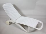 a white plastic chaise with wheels on a white background