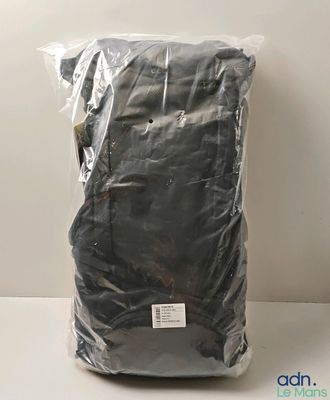 a close up of a bag of black cloth on a table