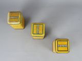 three yellow tinned boxes with the words winnvye on them