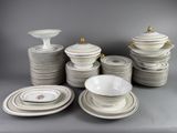 a lot of plates and bowls on the table