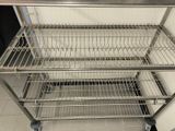 a metal cart that is sitting in the middle of the floor