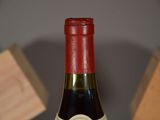 a bottle of wine that is sitting on a table