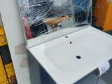 a white sink and a mirror in a room