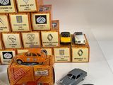 many toy cars that are sitting on top of each other