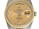 an image of a gold and silver rolex watch with diamonds