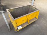 a yellow box sitting on the ground next to a fork