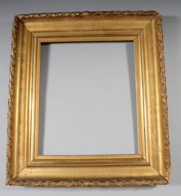an antique gold frame with a decorative pattern on the edge