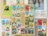 several children ' s books are displayed on a wall in a room