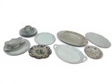 a lot of plates and bowls that are sitting on a table