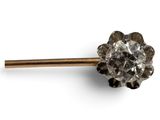 a close up of a metal object with a flower on it
