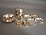 a silver plate and silverware sitting on a table