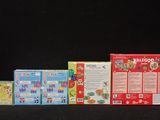 several boxes of cereal are lined up on a black surface