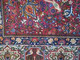 a person that is working on a rug on the floor