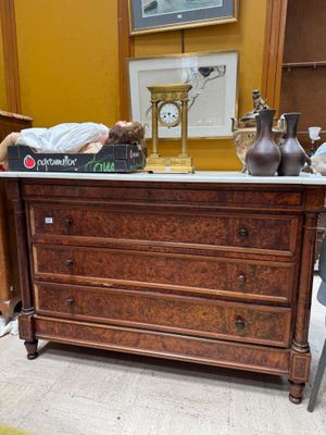 a man laying on top of a dresser in a room
