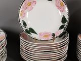 many plates stacked on top of each other on a table