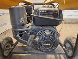 an image of a small engine on a cart