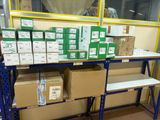 many boxes and boxes on a shelf in a warehouse