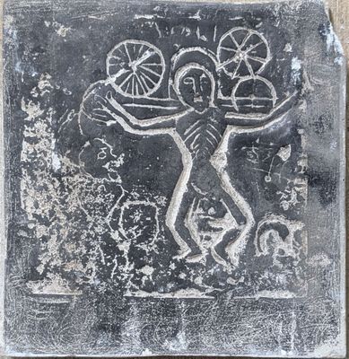 an image of a stone with a drawing on it
