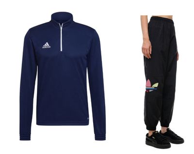 a man in a blue shirt and black pants standing next to a pair of black sweatpants