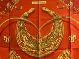 a picture of a red scarf with a gold and red design