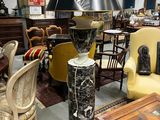 a lamp that is sitting on a table in a room