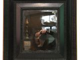 a woman taking a picture of herself in a mirror