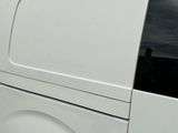 the back of a white van parked in a parking lot