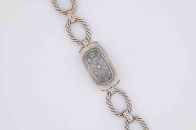 an image of a wrist watch with a chain around it