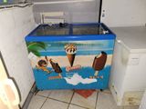 an ice cream machine in the corner of a kitchen