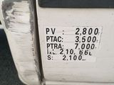 a close up of a white truck with a sticker on it ' s side