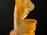an image of a yellow sculpture of a woman ' s head