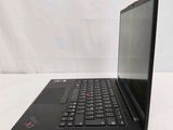 the laptop is open on a white surface with a white background
