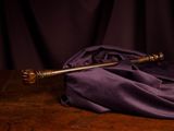a wooden table with a purple cloth on it