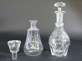 three glass vases sitting next to each other on a table