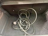 a bunch of wires in the trunk of a car