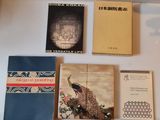 many books that are on display on a table