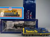 a toy train that is sitting next to a box