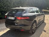 a black car that is parked on the side of the road