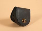 a black leather wallet case with a gold gg logo on the front