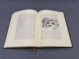 un livre ouvert sur lequel est dessiné un pont