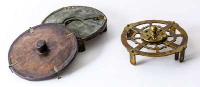 two small metal objects sitting next to each other