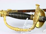 a close up of a sword on display on a table