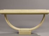 an image of a wooden table with a curved base on a grey background