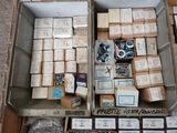 a box full of boxes of assorted items on the floor