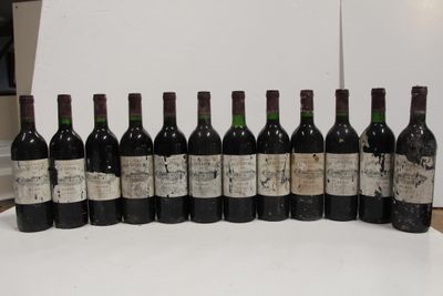 several bottles of wine are lined up in a row on a table