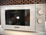 a microwave that is sitting on a counter in a kitchen