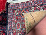 a close up of a rug with a cone on top of it