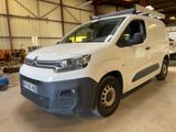 a white van that is parked in a garage
