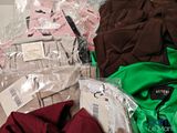 a pile of clothing that is sitting on the floor