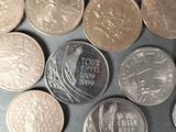 a lot of coins that are on the table